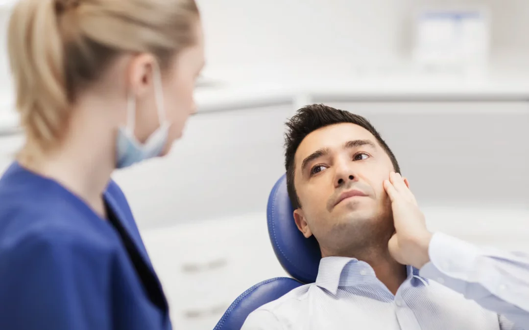 man consulting a dentist
