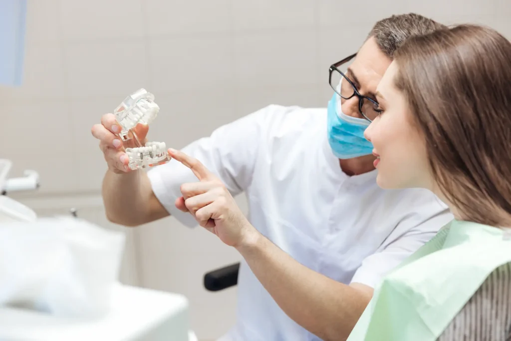dentist explaining dental implant to a patient