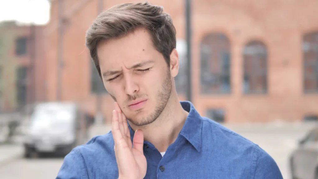 man with a toothache when walking